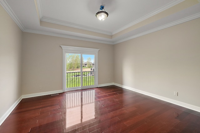 66701 Notre Dame Blvd, Washington, MI 48095 - spare room featuring dark wood-style flooring, crown molding, and a raised ceiling