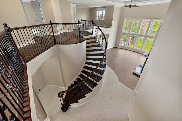 66701 Notre Dame Blvd, Washington, MI 48095 - stairs featuring tile patterned flooring, a ceiling fan, and crown molding