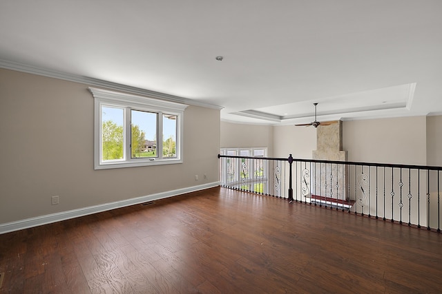 66701 Notre Dame Blvd, Washington, MI 48095 - unfurnished room with a ceiling fan, healthy amount of natural light, wood finished floors, a raised ceiling, and crown molding