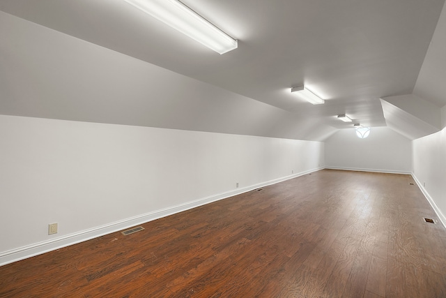 66701 Notre Dame Blvd, Washington, MI 48095 - additional living space featuring vaulted ceiling and dark wood-style flooring