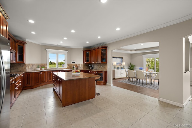66701 Notre Dame Blvd, Washington, MI 48095 - kitchen with ornamental molding, recessed lighting, arched walkways, tasteful backsplash, and a kitchen island