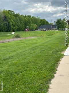 4412 Aster Blvd, Howell, MI 48843 - view of property's community featuring a yard