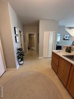 4412 Aster Blvd, Howell, MI 48843 - corridor with light colored carpet and baseboards