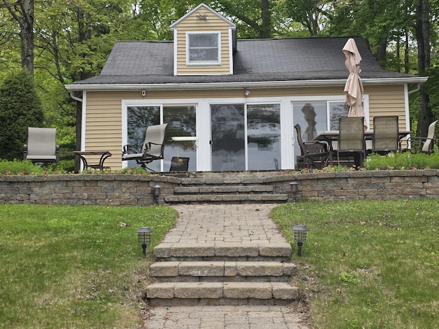 5022 N Ford Lake Rd, Fountain, MI 49410 - view of front facade featuring a front lawn and a patio area