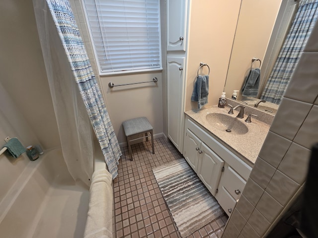5022 N Ford Lake Rd, Fountain, MI 49410 - bathroom featuring vanity, tile patterned floors, and shower / bathtub combination with curtain