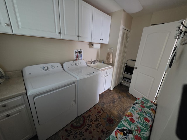 5022 N Ford Lake Rd, Fountain, MI 49410 - laundry area with cabinet space, separate washer and dryer, and stone finish floors