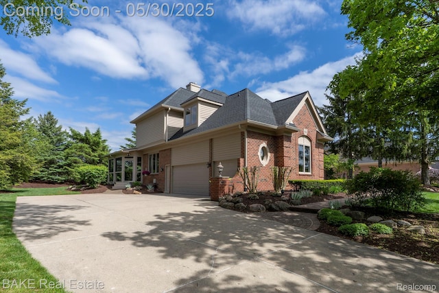 966 Mcdonald Dr, Northville, MI 48167 - view of property exterior featuring brick siding, concrete driveway, and roof with shingles