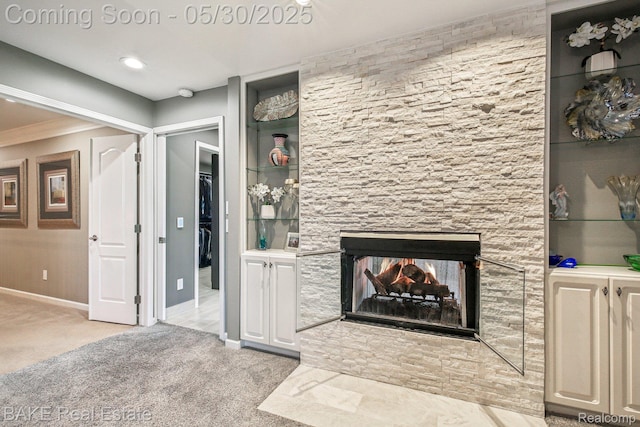 966 Mcdonald Dr, Northville, MI 48167 - unfurnished living room featuring carpet floors, ornamental molding, baseboards, and a multi sided fireplace