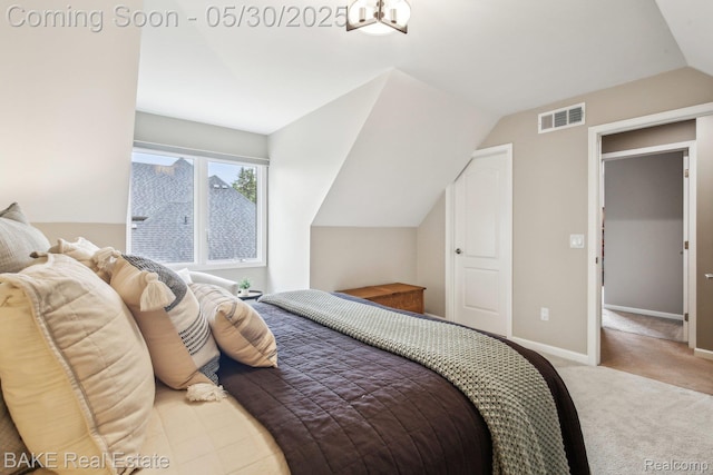 966 Mcdonald Dr, Northville, MI 48167 - carpeted bedroom featuring lofted ceiling and baseboards