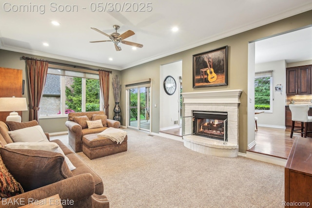 966 Mcdonald Dr, Northville, MI 48167 - living room with crown molding, a ceiling fan, a brick fireplace, recessed lighting, and carpet floors