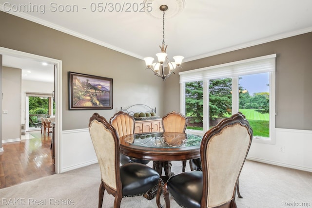 966 Mcdonald Dr, Northville, MI 48167 - dining area featuring a chandelier, light carpet, crown molding, and baseboards