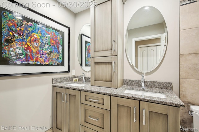 966 Mcdonald Dr, Northville, MI 48167 - bathroom featuring double vanity and toilet