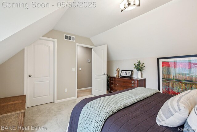 966 Mcdonald Dr, Northville, MI 48167 - carpeted bedroom with vaulted ceiling