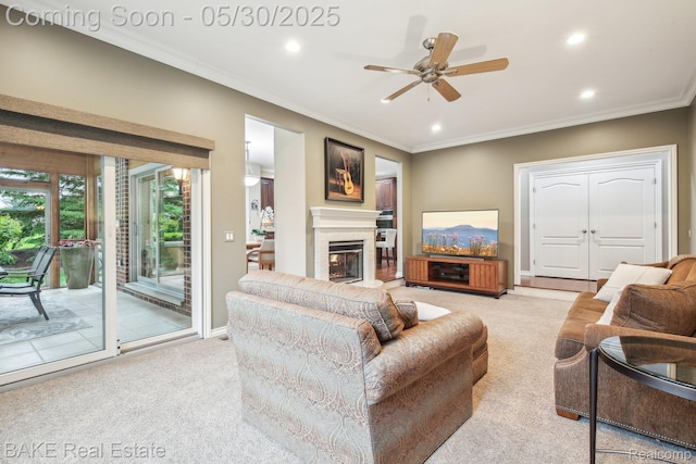 966 Mcdonald Dr, Northville, MI 48167 - living area featuring light carpet, ornamental molding, recessed lighting, a ceiling fan, and a fireplace