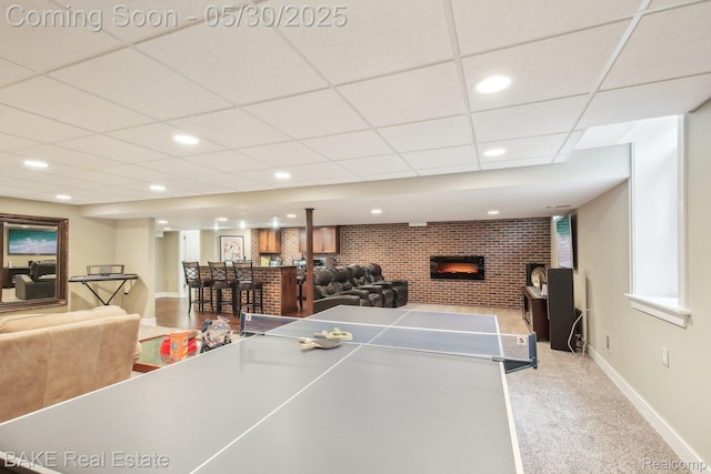 966 Mcdonald Dr, Northville, MI 48167 - game room with brick wall, bar, carpet floors, baseboards, and a brick fireplace