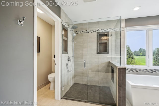 966 Mcdonald Dr, Northville, MI 48167 - bathroom featuring toilet, a stall shower, a bath, recessed lighting, and baseboards