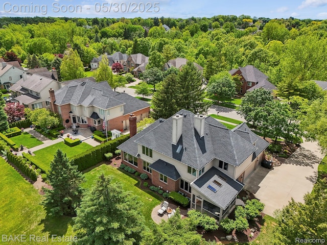 966 Mcdonald Dr, Northville, MI 48167 - aerial view of residential area featuring a heavily wooded area