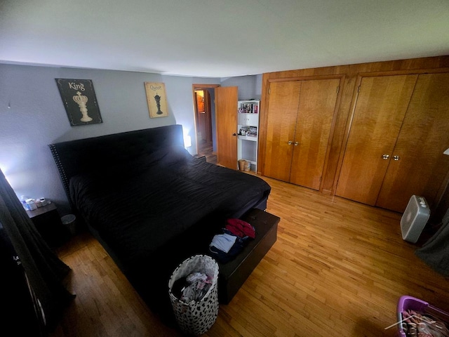 3775 N Hemlock Rd, Hemlock, MI 48626 - bedroom with light wood-type flooring