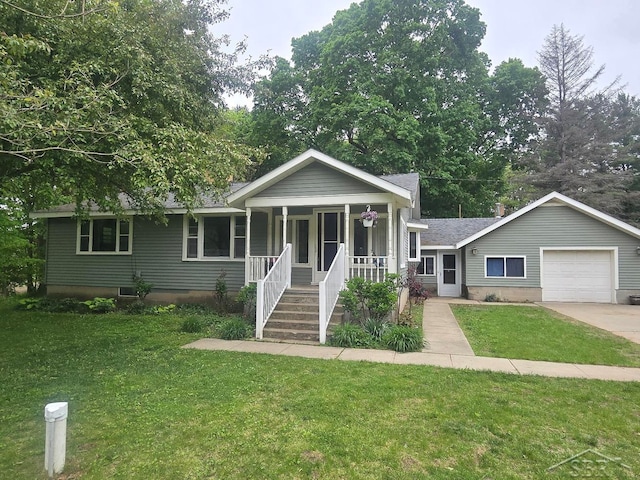 3775 N Hemlock Rd, Hemlock, MI 48626 - view of front of home featuring covered porch, a front lawn, driveway, an attached garage, and roof with shingles