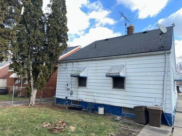 17659 Teppert St, Detroit, MI 48234 - back of property featuring a chimney and a shingled roof