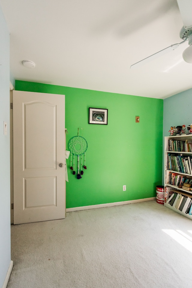 interior space featuring baseboards and a smoke detector