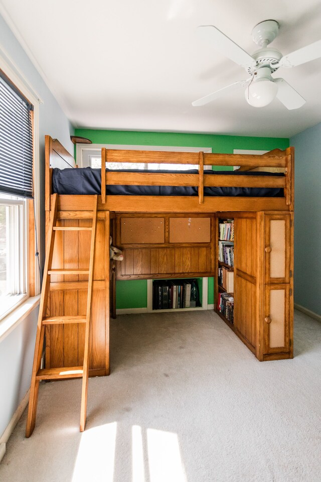 unfurnished bedroom with carpet floors and baseboards