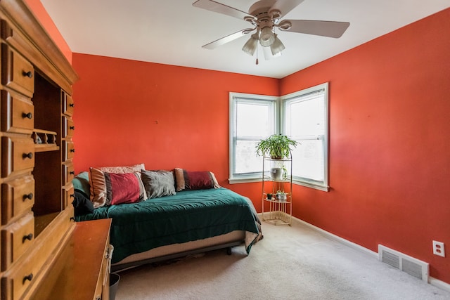 bedroom with carpet flooring, baseboards, and ceiling fan