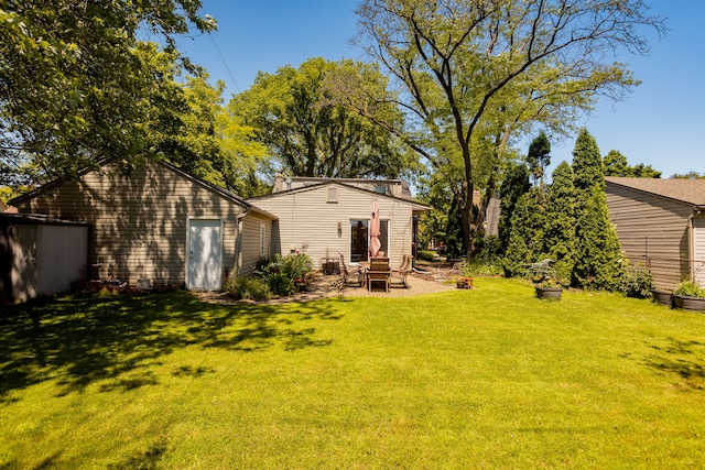 view of grassy yard with a patio
