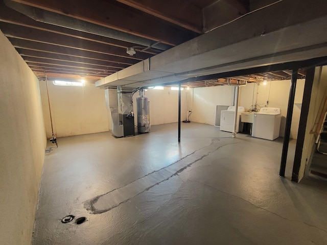 16442 Brandt St, Romulus, MI 48174 - unfinished below grade area featuring washing machine and clothes dryer, water heater, and heating unit
