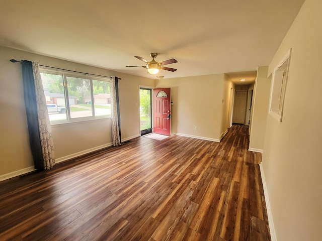 16442 Brandt St, Romulus, MI 48174 - unfurnished room featuring dark wood finished floors, baseboards, plenty of natural light, and a ceiling fan