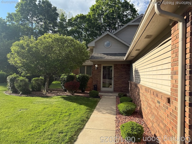 3052 Rivers Edge Dr, Wayne, MI 48184 - entrance to property with brick siding and a yard