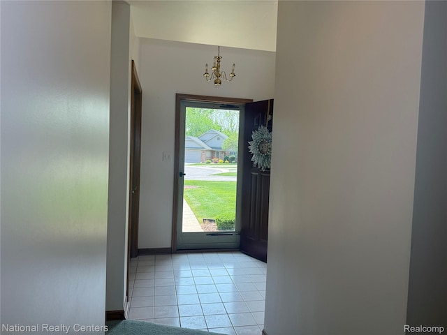 3052 Rivers Edge Dr, Wayne, MI 48184 - foyer entrance featuring a chandelier, light tile patterned floors, and baseboards