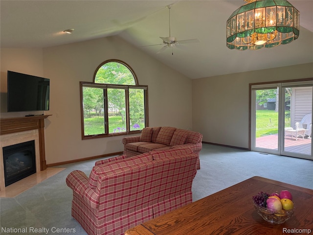 3052 Rivers Edge Dr, Wayne, MI 48184 - carpeted living area with healthy amount of natural light, a ceiling fan, vaulted ceiling, baseboards, and a premium fireplace