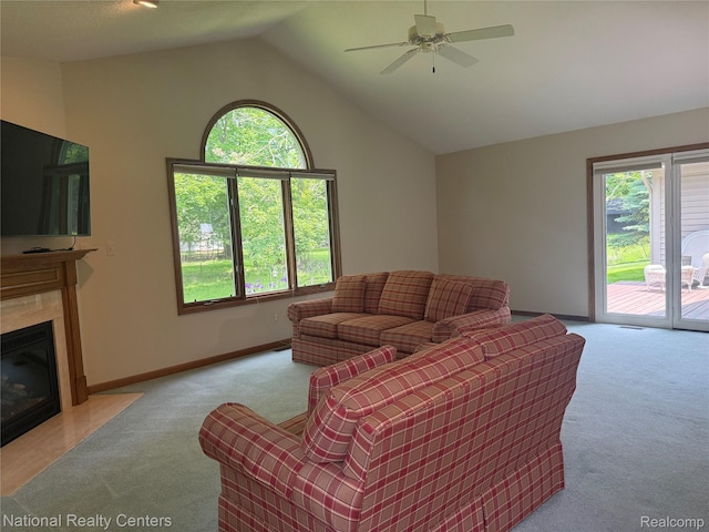 3052 Rivers Edge Dr, Wayne, MI 48184 - carpeted living room featuring lofted ceiling, a ceiling fan, a high end fireplace, and baseboards