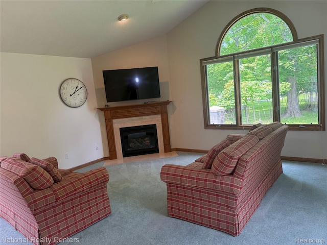 3052 Rivers Edge Dr, Wayne, MI 48184 - carpeted living area with vaulted ceiling, baseboards, and a fireplace with flush hearth