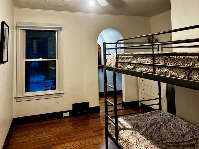 404 Pauline Blvd, Ann Arbor, MI 48103 - bedroom with dark wood-type flooring, arched walkways, and baseboards