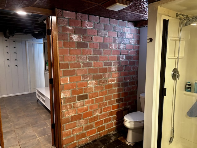 404 Pauline Blvd, Ann Arbor, MI 48103 - full bath featuring brick wall, toilet, and a shower