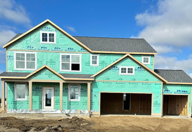 3317 Rocaway Dr, Hudsonville, MI 49426 - property under construction featuring a shingled roof, covered porch, and driveway