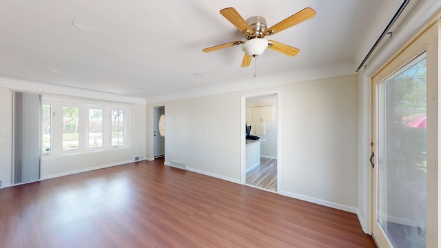 26817 Newport Ave, Warren, MI 48089 - unfurnished room featuring wood finished floors, baseboards, and a ceiling fan