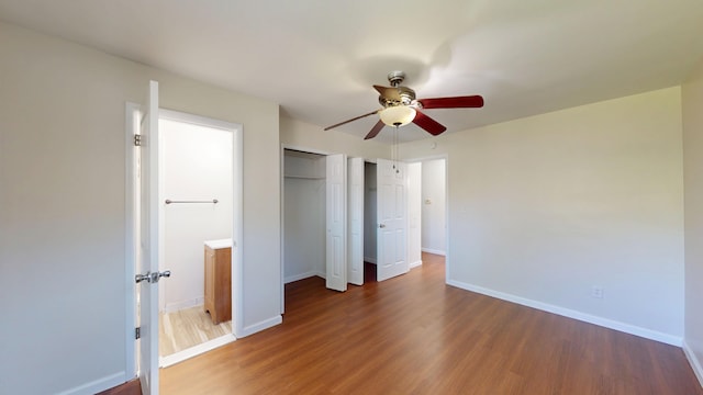 26817 Newport Ave, Warren, MI 48089 - unfurnished bedroom with wood finished floors, a closet, baseboards, and ceiling fan