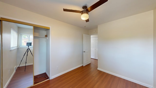 26817 Newport Ave, Warren, MI 48089 - unfurnished bedroom featuring wood finished floors, baseboards, a closet, and a ceiling fan