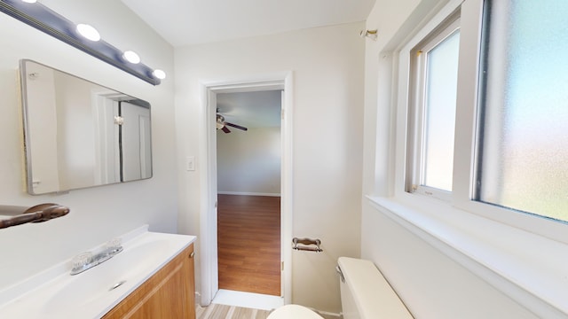26817 Newport Ave, Warren, MI 48089 - bathroom with ceiling fan, toilet, vanity, and wood finished floors