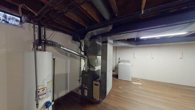 26817 Newport Ave, Warren, MI 48089 - unfinished below grade area featuring gas water heater, wood finished floors, washer / dryer, and heating unit