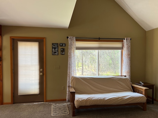 11055 Kopko Trl, Roscommon, MI 48653 - living area with lofted ceiling, carpet flooring, and baseboards