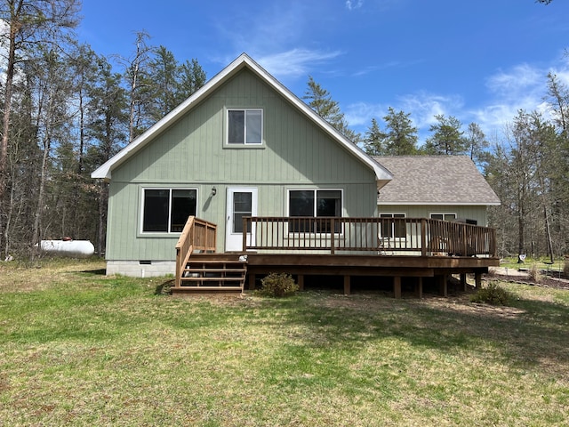 11055 Kopko Trl, Roscommon, MI 48653 - back of property with a wooden deck, a lawn, crawl space, and roof with shingles
