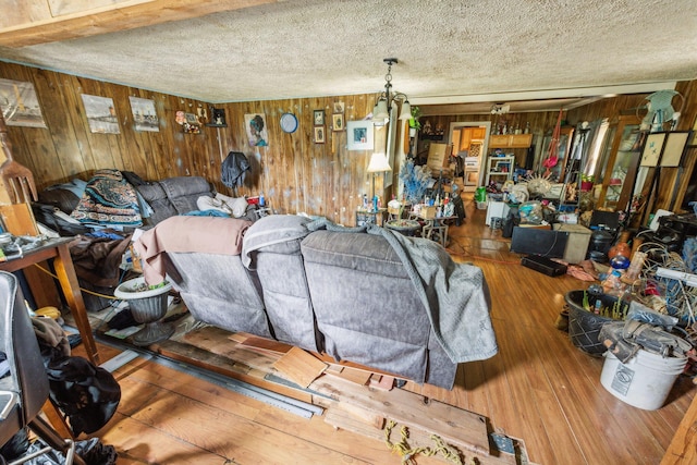 526 S Front St, Dowagiac, MI 49047 - living area with wooden walls, hardwood / wood-style flooring, and a textured ceiling