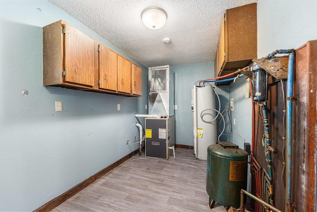 50 N Pine St, Breedsville, MI 49027 - utility room featuring water heater and heating unit