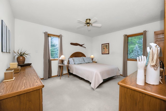 838 Able Rd, Buchanan, MI 49107 - bedroom featuring light carpet, multiple windows, ceiling fan, and baseboards