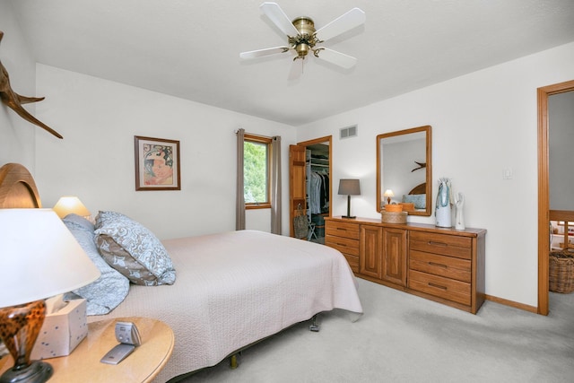 838 Able Rd, Buchanan, MI 49107 - bedroom featuring light colored carpet, a spacious closet, a closet, ceiling fan, and baseboards