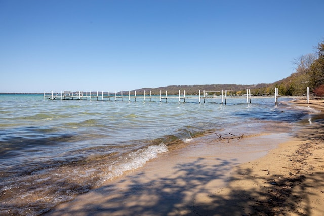8432 S Dunns Farm Rd, Maple City, MI 49664 - water view featuring a boat dock